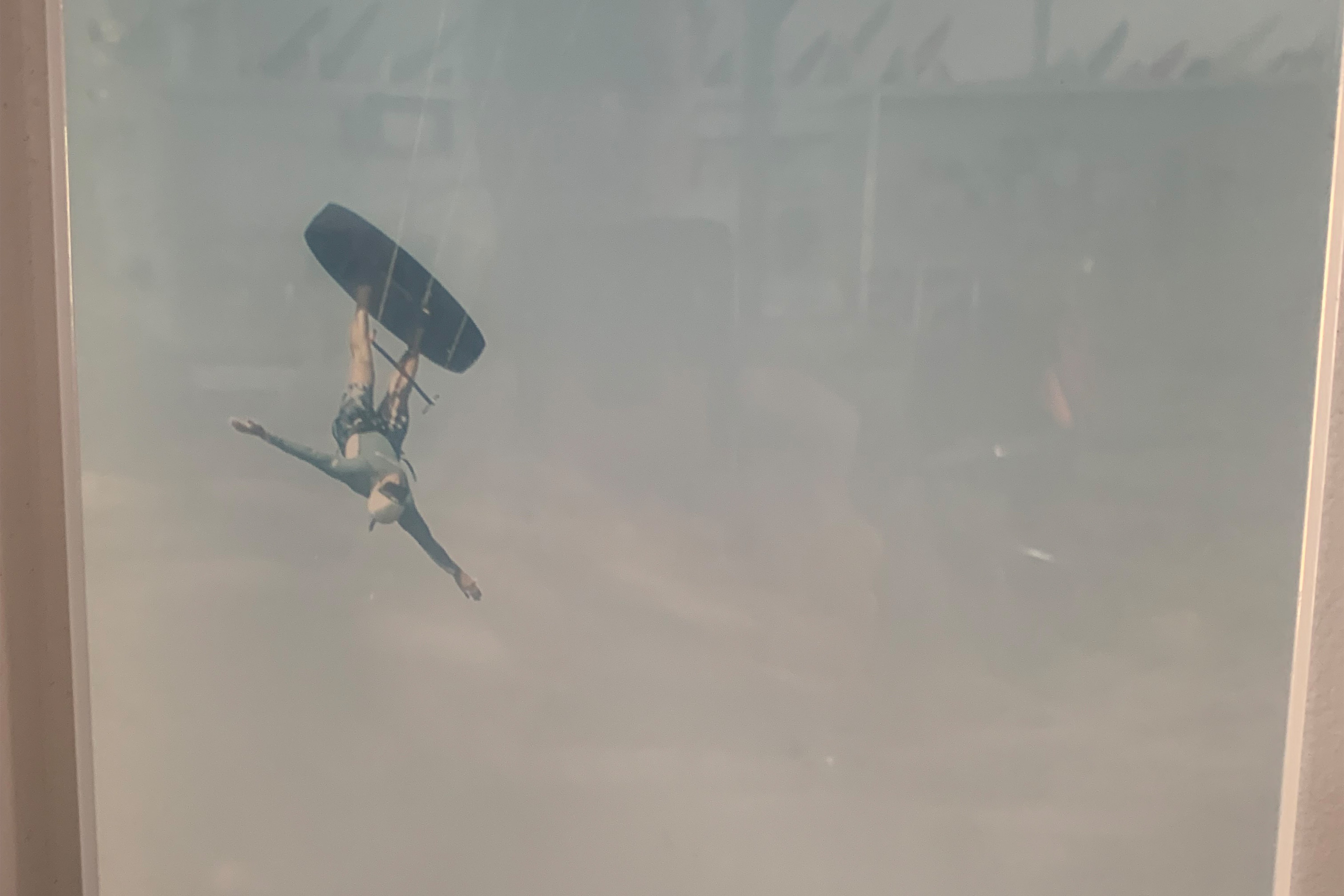 Person doing a kiteboarding trick